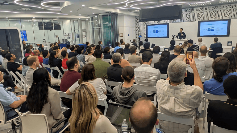 A packed audience at Vibe Days event in Miami, showcasing collaboration between AI, entrepreneurship, and creative industries, sponsored by Open Access Ventures.